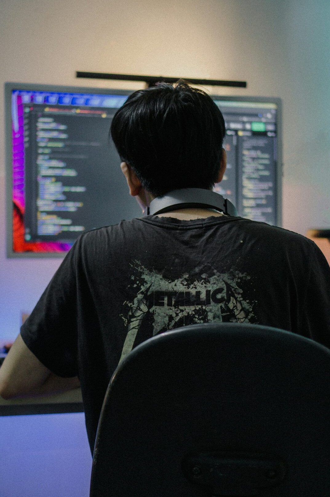 man coding at desk
