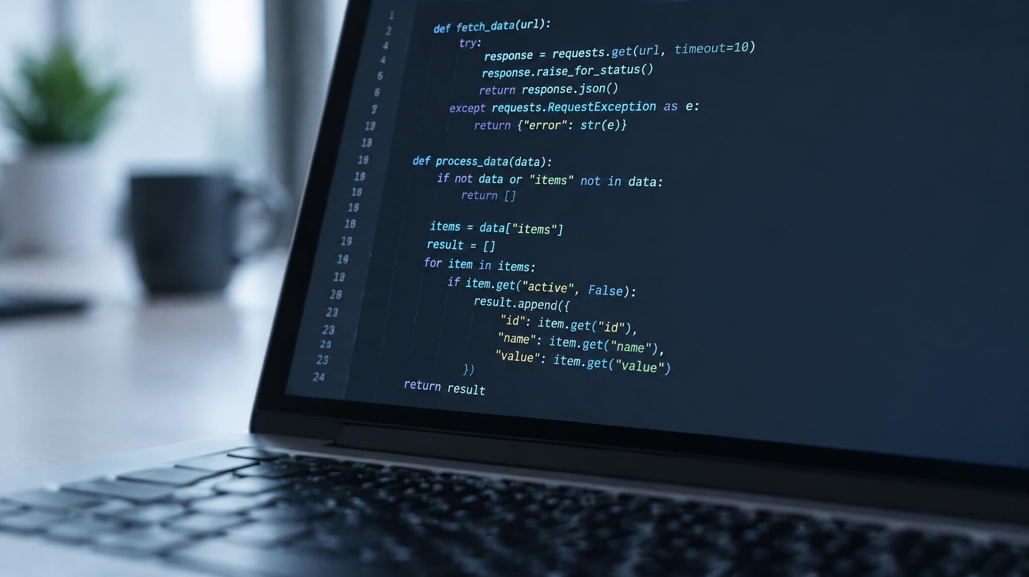 Close-up of code displayed on a laptop screen